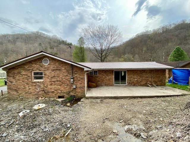 rear view of house featuring a patio area