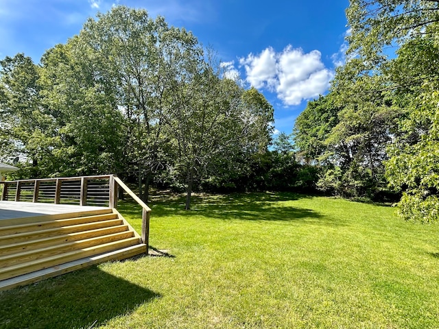 view of yard with a wooden deck