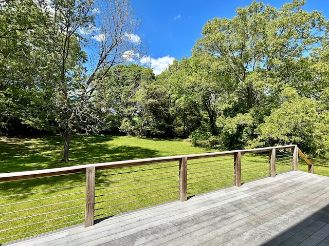 wooden deck with a lawn