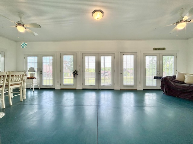 interior space with ceiling fan and french doors