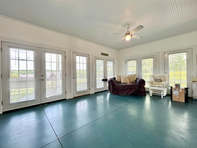 sunroom / solarium with french doors and ceiling fan