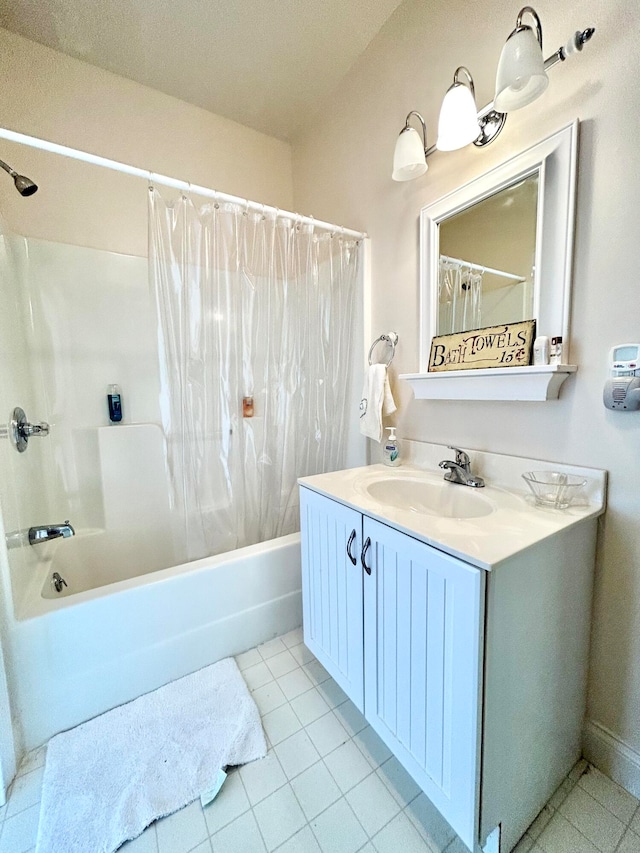 bathroom with tile flooring, vanity, and shower / bath combo with shower curtain