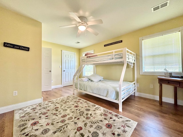 bedroom featuring ceiling fan and light hardwood / wood-style flooring