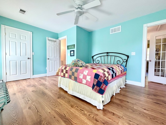 bedroom featuring ceiling fan and light hardwood / wood-style flooring