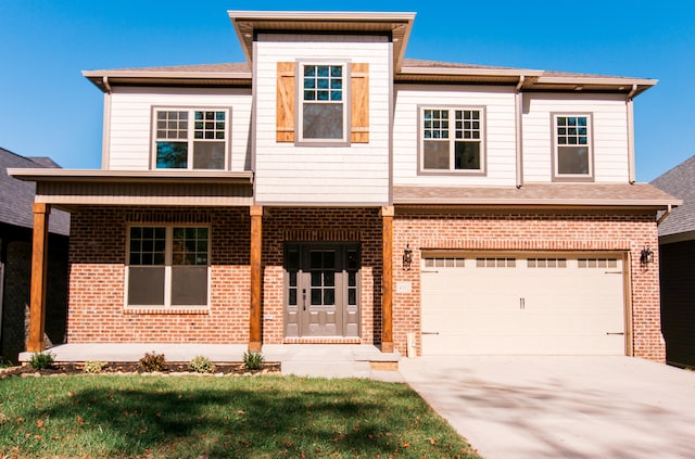 view of front of property with a front lawn and a garage