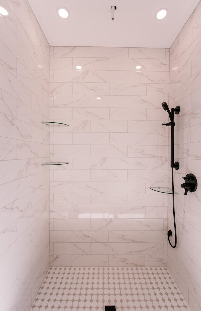 bathroom with tiled shower