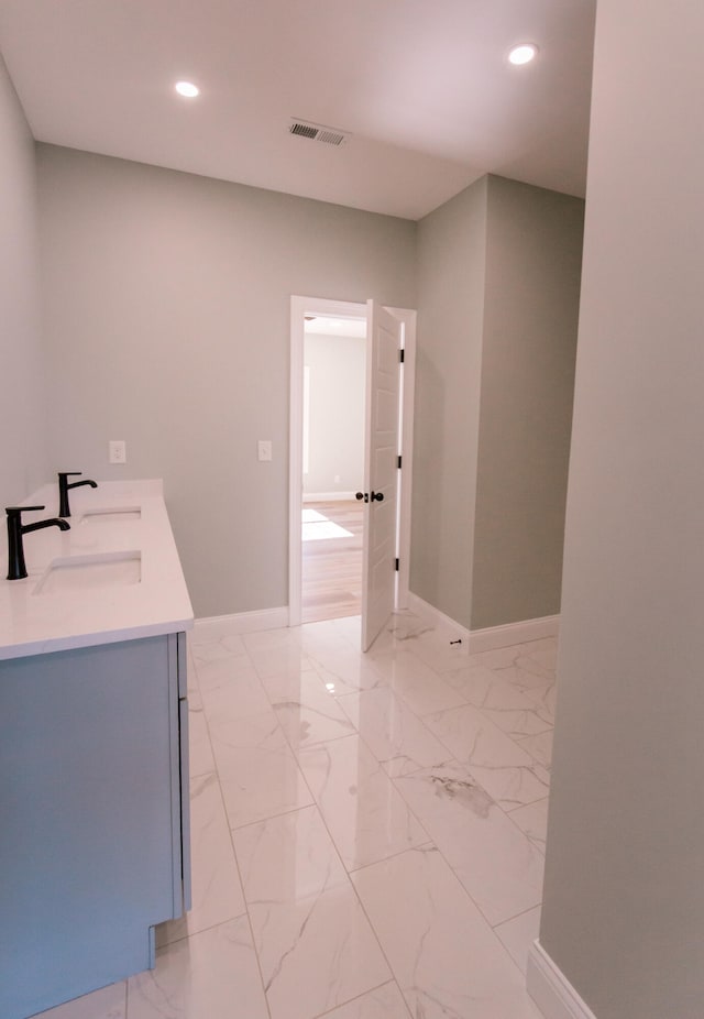 bathroom featuring tile floors and vanity