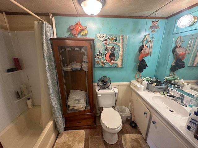 full bathroom with vanity, shower / bath combo, tile floors, a textured ceiling, and toilet