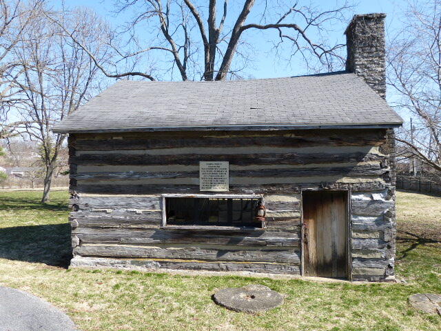 exterior space with a lawn and a fireplace