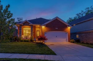 view of front of property with a front yard and a garage