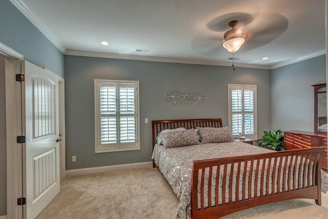 bedroom with multiple windows, crown molding, light carpet, and ceiling fan