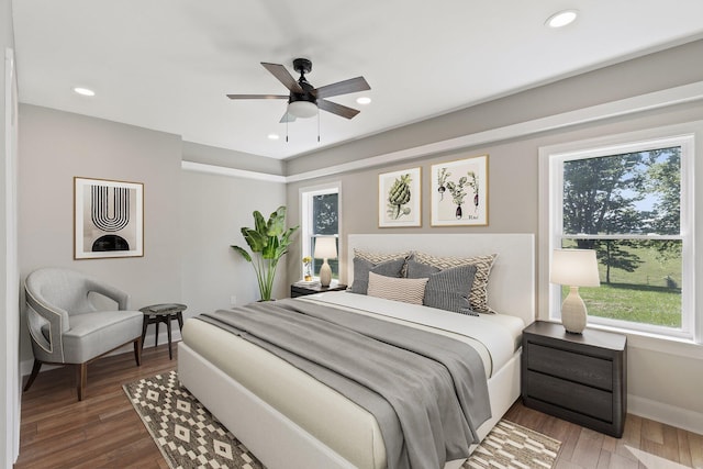 bedroom featuring recessed lighting, baseboards, wood finished floors, and ceiling fan