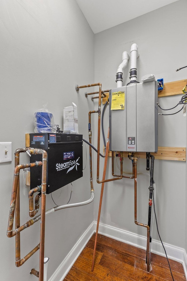 utility room featuring tankless water heater