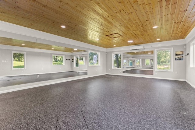 interior space with baseboards, an AC wall unit, a wall unit AC, recessed lighting, and wooden ceiling