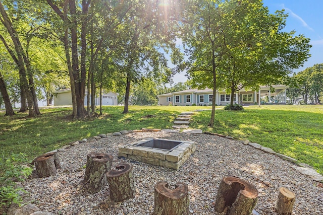 view of yard with a fire pit