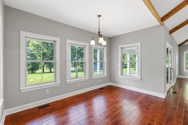 unfurnished dining area with dark wood-style floors, visible vents, and baseboards