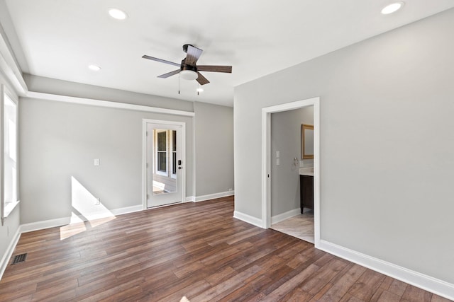 spare room with recessed lighting, visible vents, baseboards, and wood finished floors