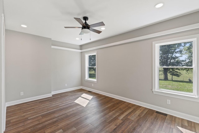 unfurnished room featuring visible vents, dark wood-type flooring, baseboards, recessed lighting, and a ceiling fan