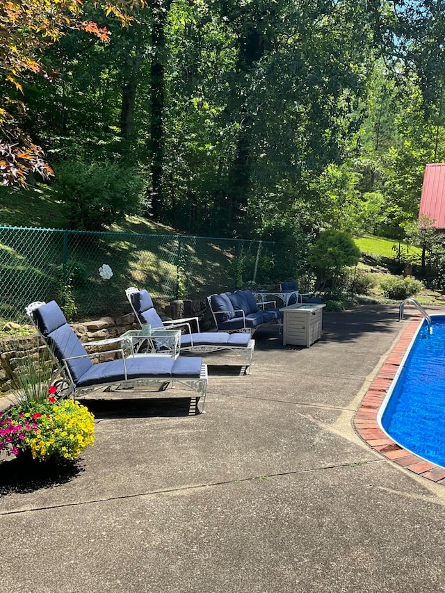 view of patio / terrace featuring a fenced in pool and outdoor lounge area