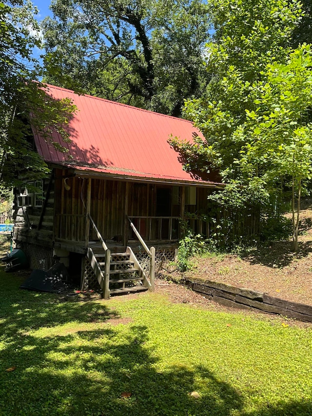 view of outdoor structure with a lawn