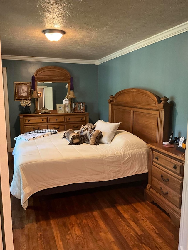 bedroom featuring a textured ceiling, ornamental molding, and dark hardwood / wood-style floors