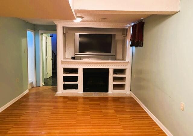 unfurnished living room with hardwood / wood-style floors