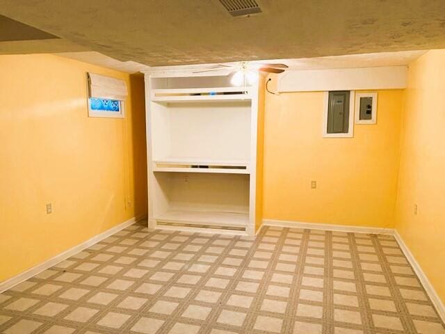 basement featuring light tile floors