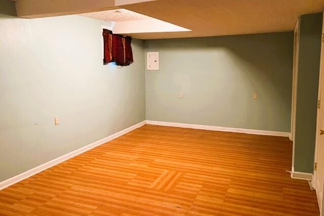 basement with wood-type flooring