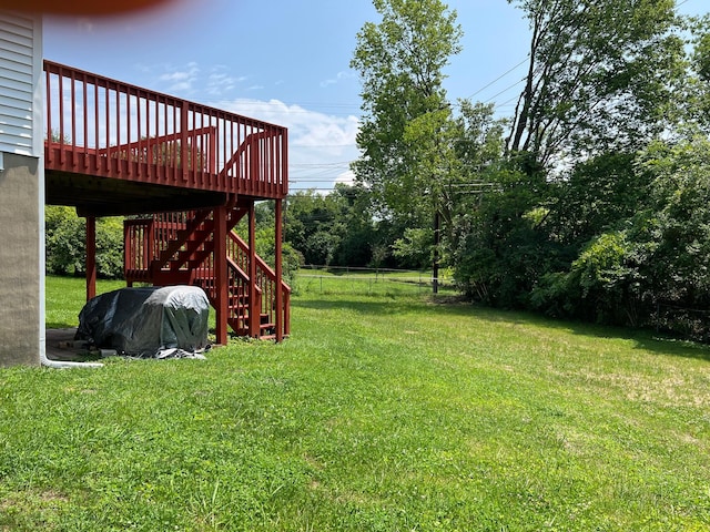 view of yard with a wooden deck