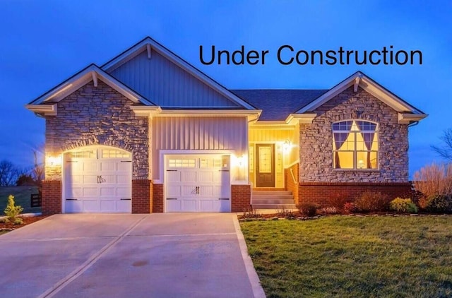 view of front of property with a front lawn and a garage