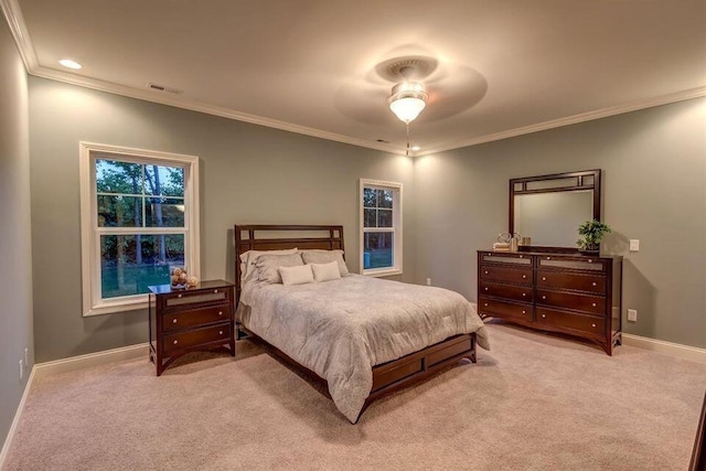 carpeted bedroom featuring ceiling fan and ornamental molding