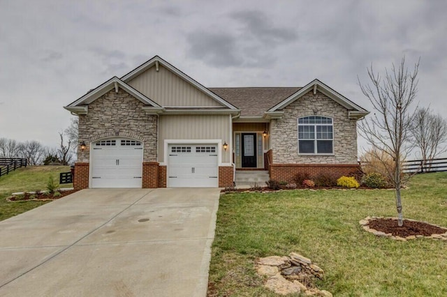 view of front of home with a front lawn and a garage