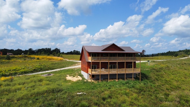 rear view of house with a rural view