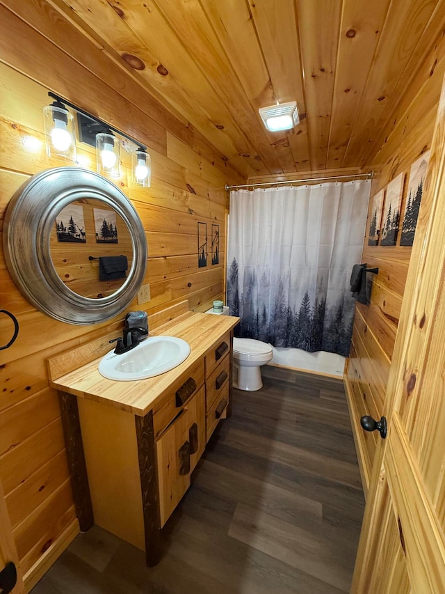 bathroom with wood walls, toilet, wooden ceiling, and hardwood / wood-style flooring