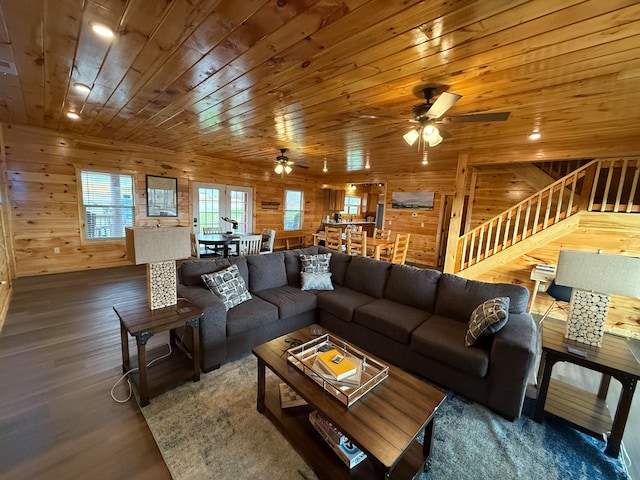 living room featuring wood walls, ceiling fan, wood ceiling, and dark hardwood / wood-style floors