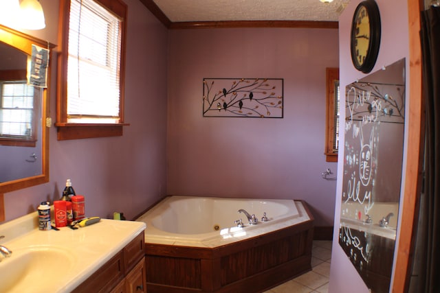 bathroom with plenty of natural light, oversized vanity, a bathing tub, and a textured ceiling