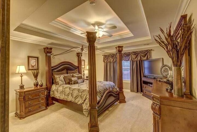 carpeted bedroom featuring ceiling fan, a raised ceiling, and crown molding