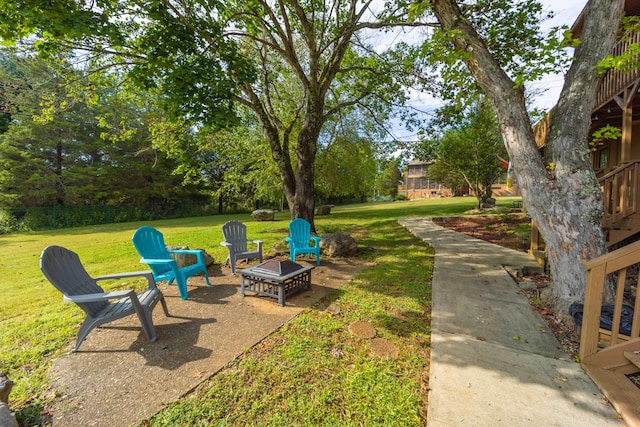 view of yard with a fire pit and a patio area