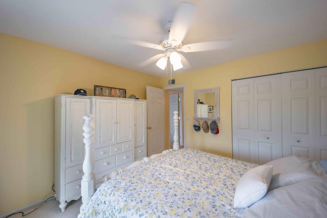 bedroom with light carpet, a closet, and ceiling fan