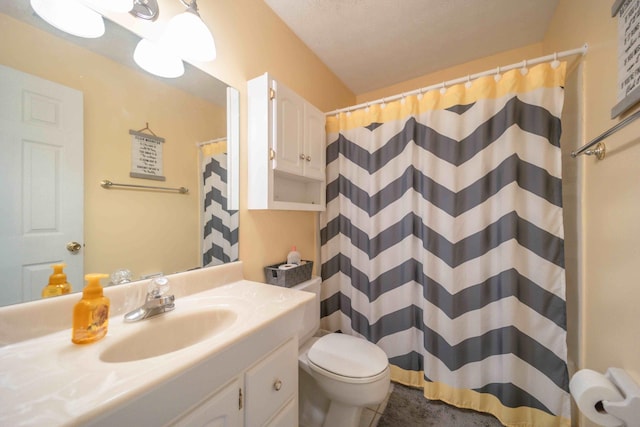 bathroom with toilet, tile floors, and vanity