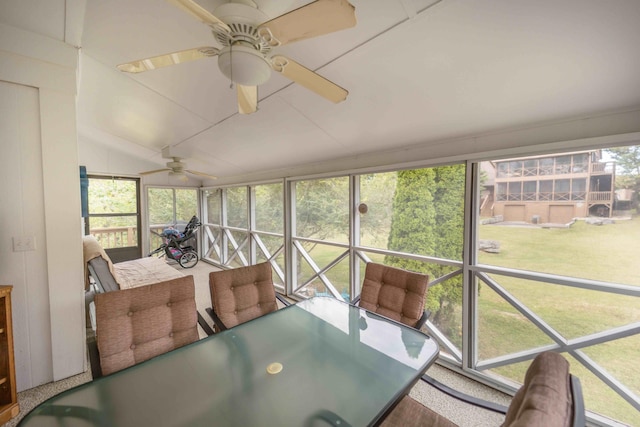 sunroom with a healthy amount of sunlight and ceiling fan