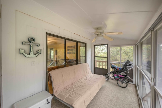 sunroom with ceiling fan and lofted ceiling