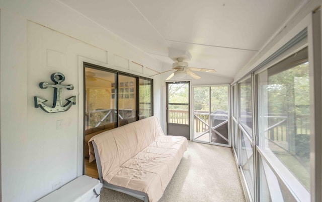 sunroom featuring ceiling fan and vaulted ceiling