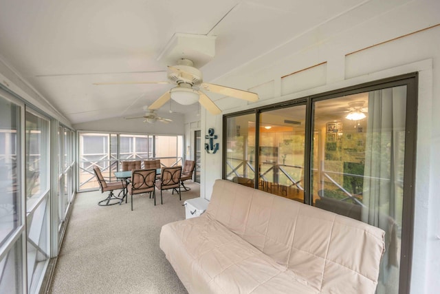 sunroom featuring lofted ceiling and ceiling fan