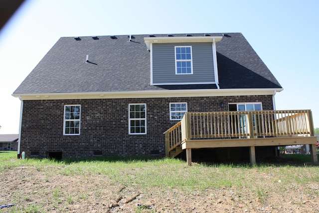 back of property with a wooden deck