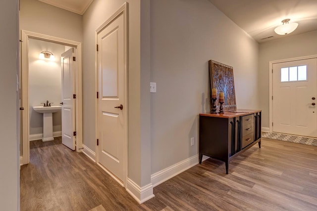 interior space with sink and hardwood / wood-style flooring