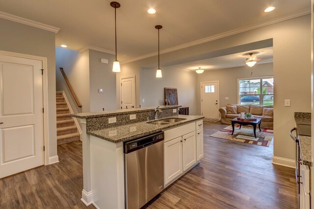 kitchen featuring decorative light fixtures, dark wood-type flooring, dark stone countertops, white cabinets, and dishwasher