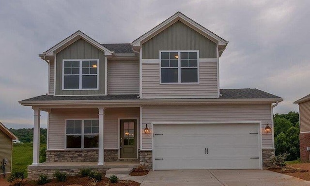 craftsman-style home featuring a porch and a garage