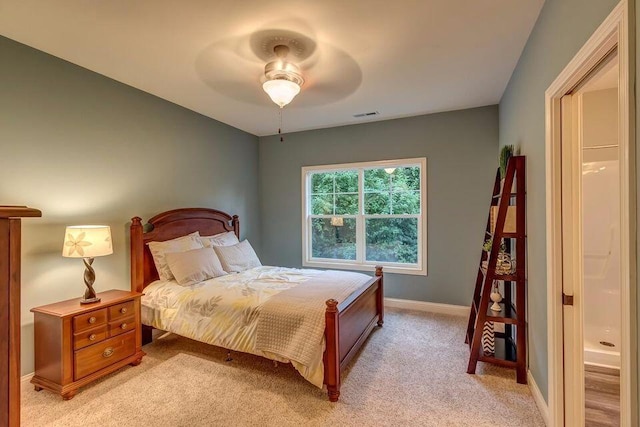 bedroom featuring light colored carpet and ceiling fan