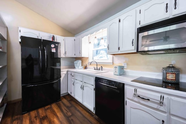 kitchen featuring vaulted ceiling, sink, white cabinetry, dark hardwood / wood-style floors, and black appliances